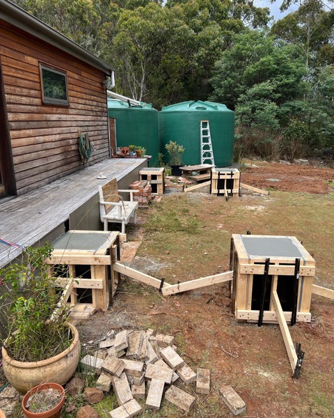 Formwork boxes set out on a rural site by TJC Building
