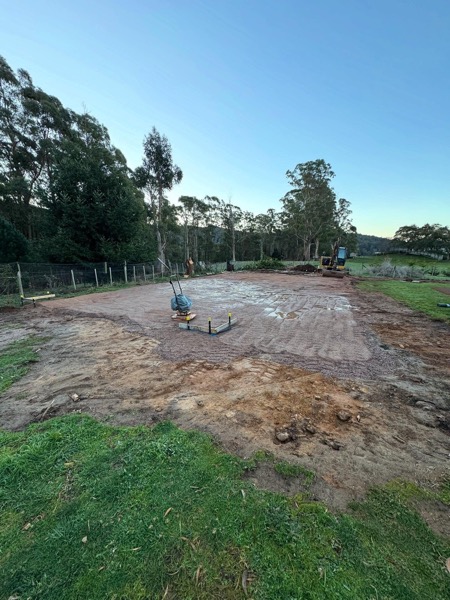 A cleared and levelled building site prepared by TJC Building
