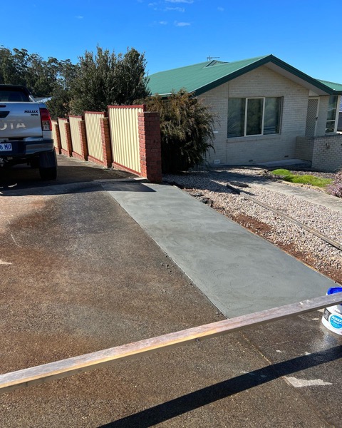 A finished concrete driveway section by TJC Building