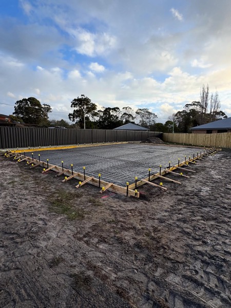 A concrete shed pad set out with formwork by TJC Building