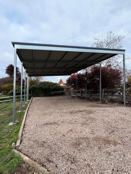 A steel carport frame erected by TJC Building