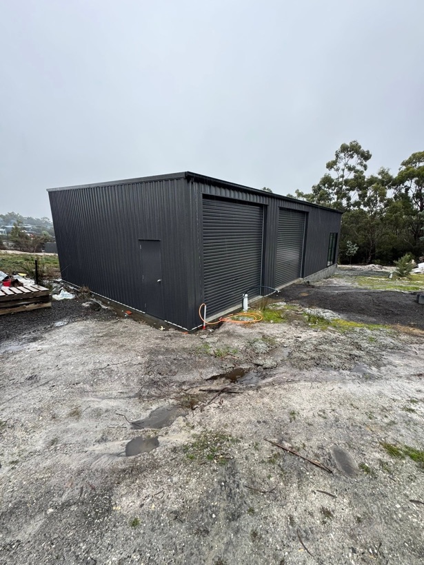 A covered concrete equipment bay built by TJC Building