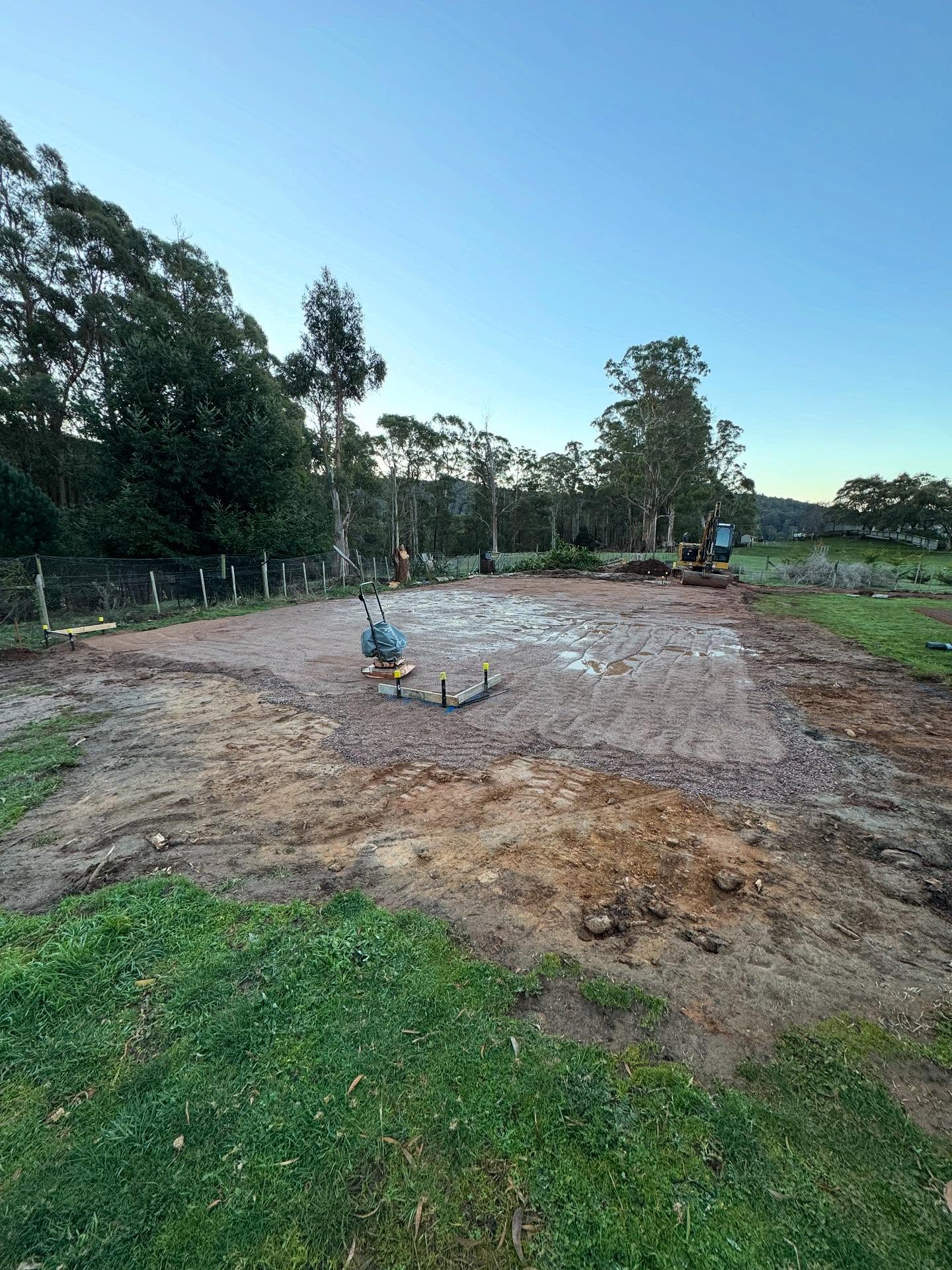 A cleared and levelled building site prepared by TJC Building