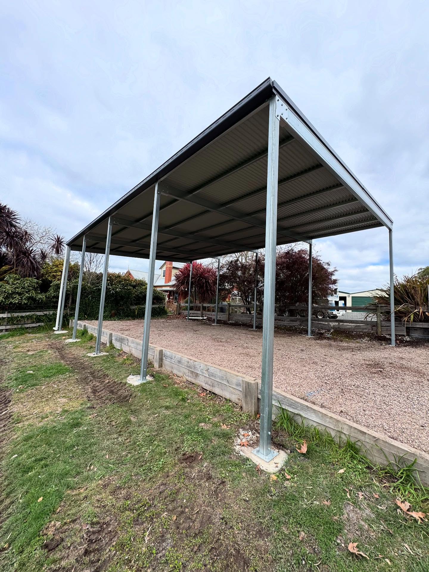 A steel shed frame erected by TJC Building on a concrete slab
