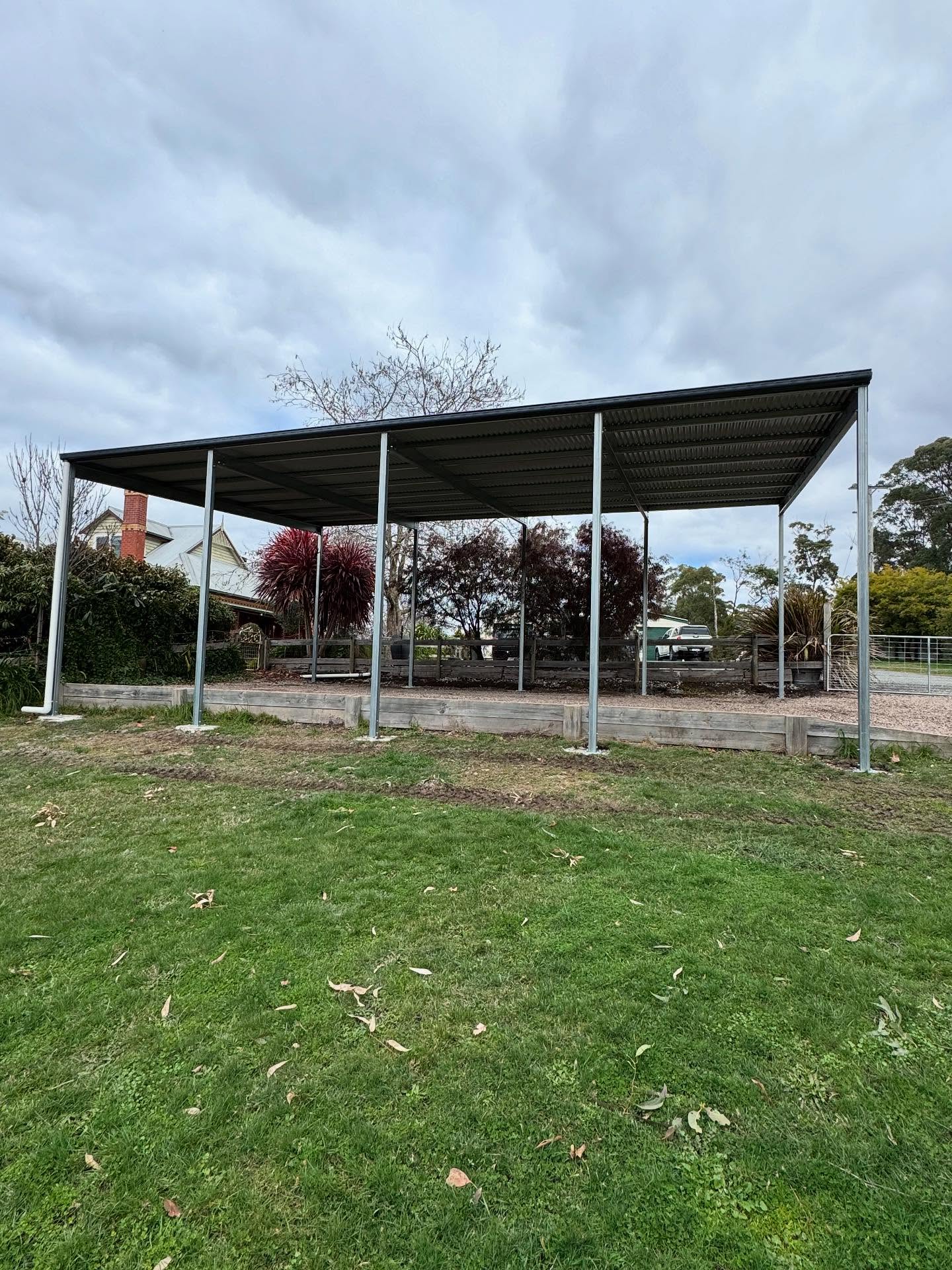A steel shed frame erected by TJC Building on a concrete slab