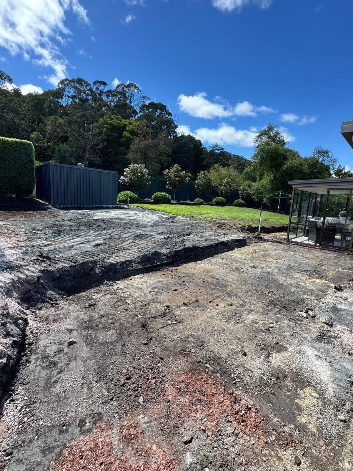 The same backyard excavated and cleared before TJC Building's work